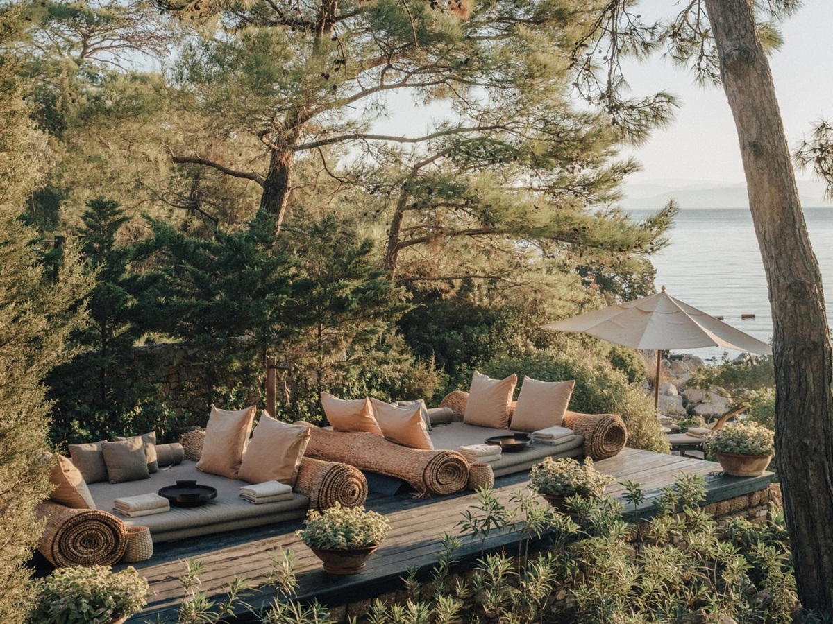 Lounging deck with large sunbeds at the Beach Club at luxury hotel Amanruya, Turkey