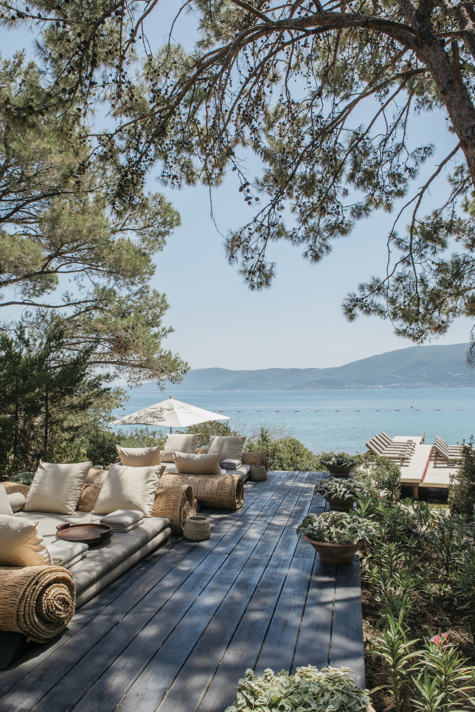 Lounging deck overlooing the sea at the Beach Club at luxury hotel Amanruya, Turkey