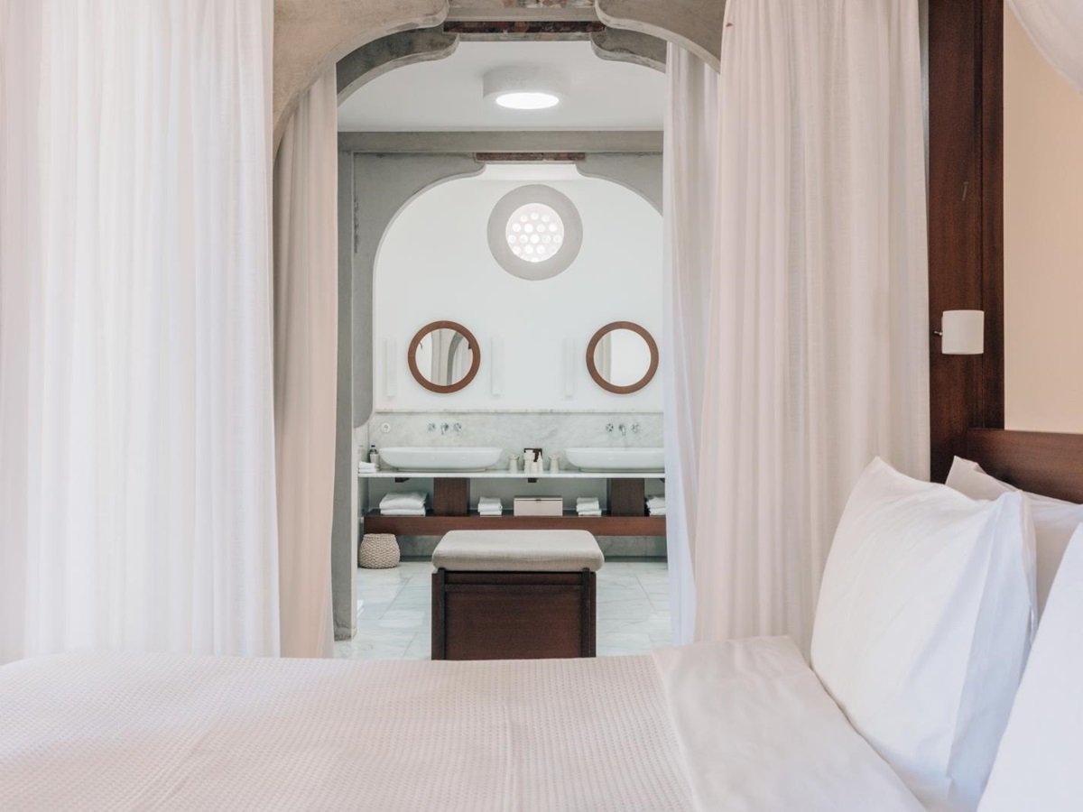 View from a pavilion bedroom into the ensuite bathroom with double vanity at luxury hotel Amanruya, Turkey