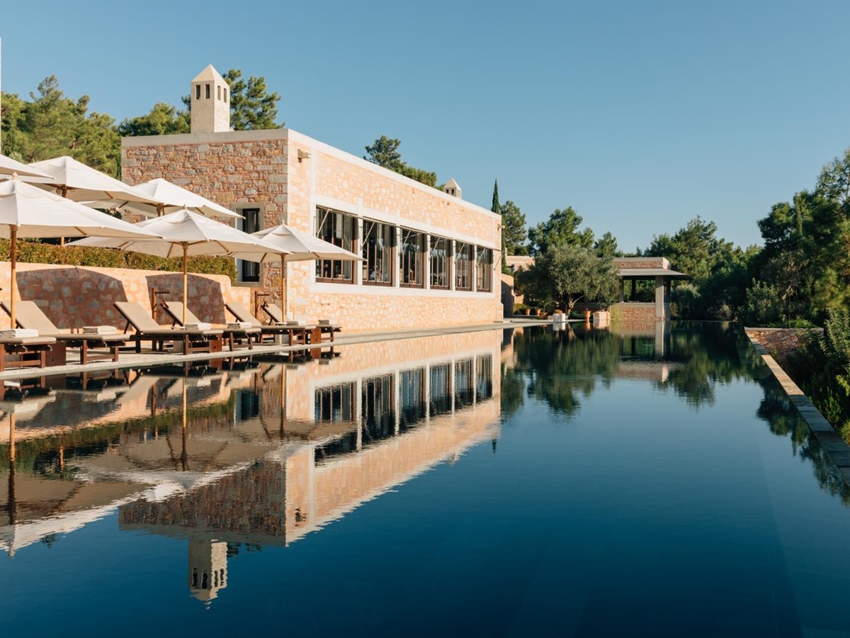 Loungers set by the main pool at luxury hotel Amanruya, Turkey