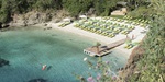 Guest kayaking in the turquoise waters in front of a beach at luxury resort D-Maris Bay in Turkey