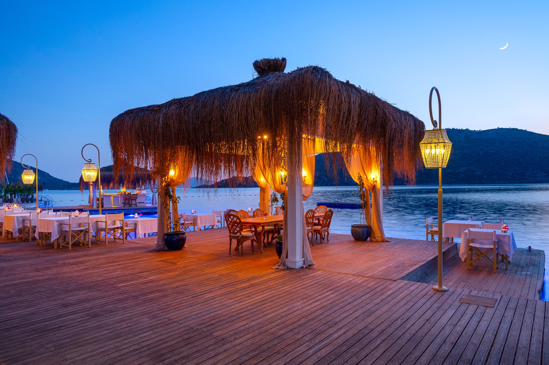 Dining under a thatch pavilion at Sabrina's Haus luxury hotel in Turkey