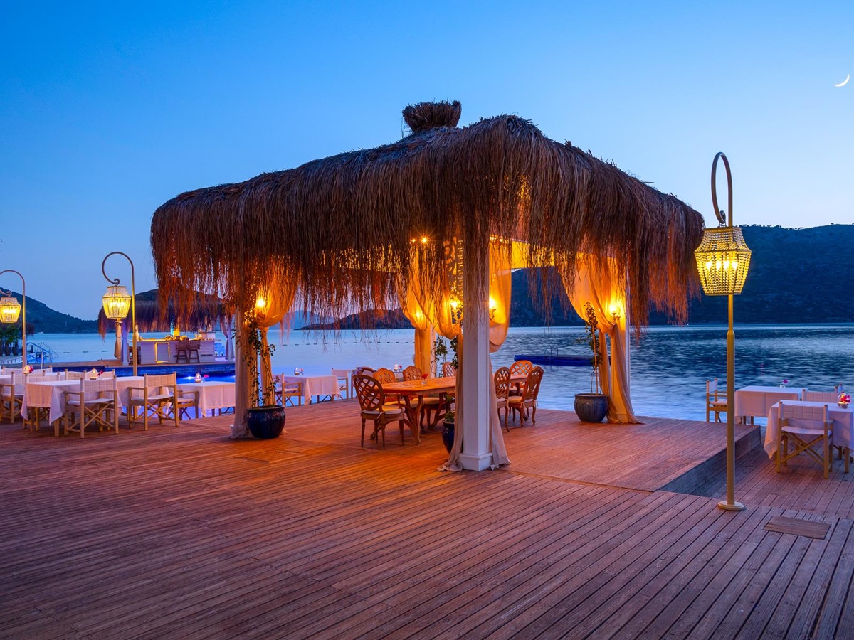 Dining under a thatch pavilion at Sabrina's Haus luxury hotel in Turkey