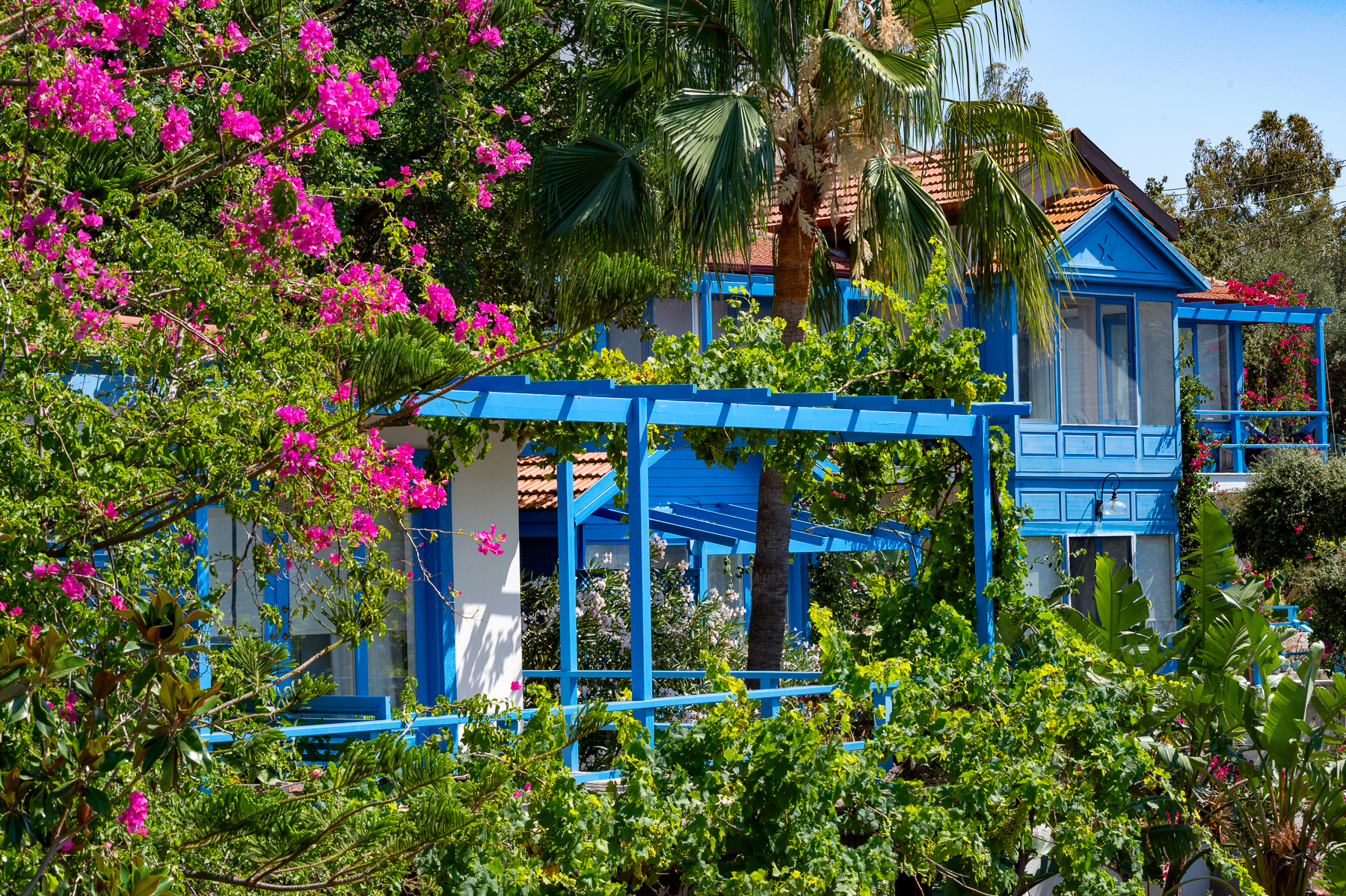 Facade and gardens of Sabrina's Haus luxury hotel in Turkey