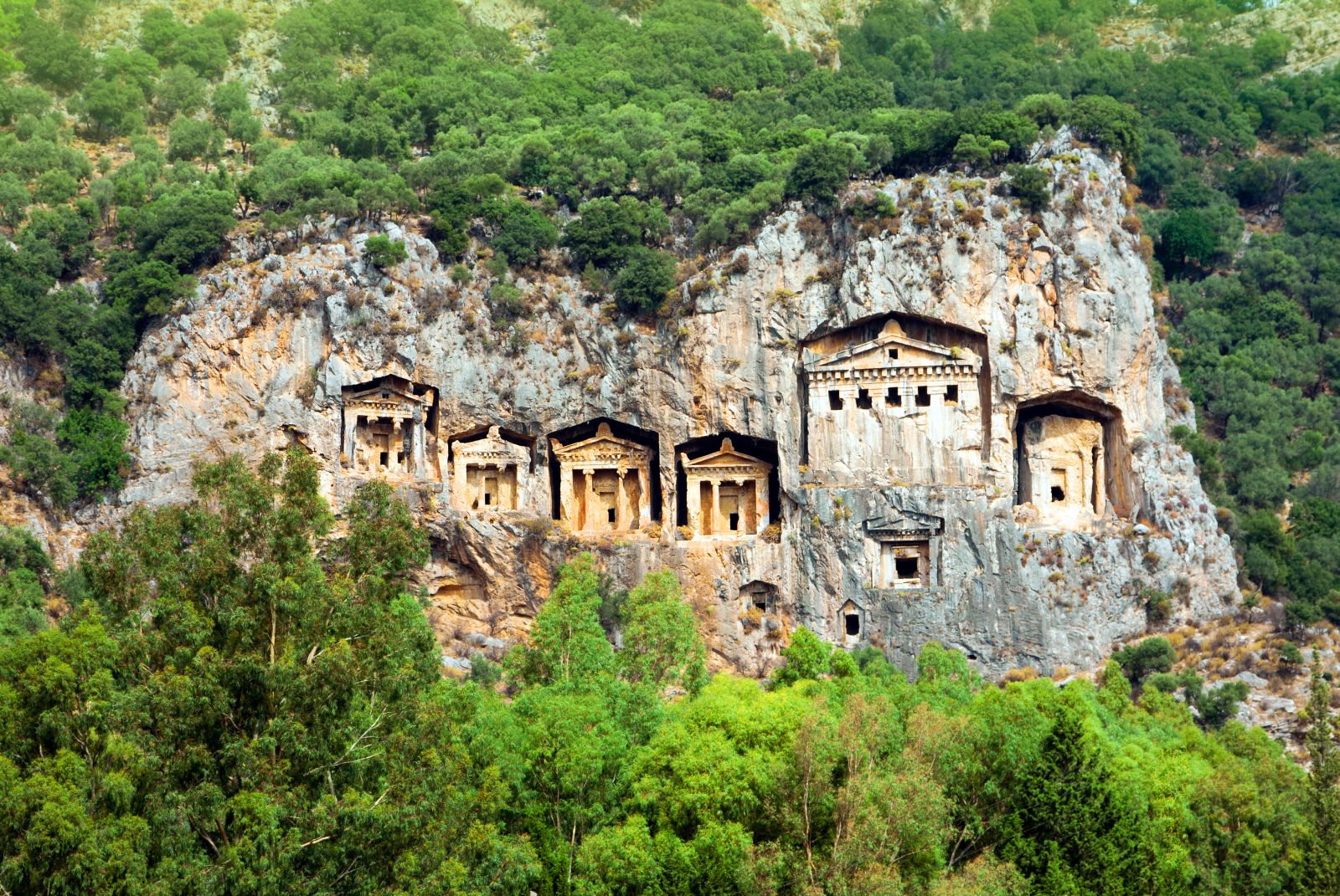 Historic tombs carved in to the cliffside at Dalyan Turkey