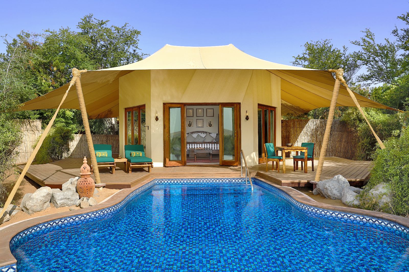 Tent exterior and pool at Al Maha A Luxury Collection Desert Resort & Spa in Dubai