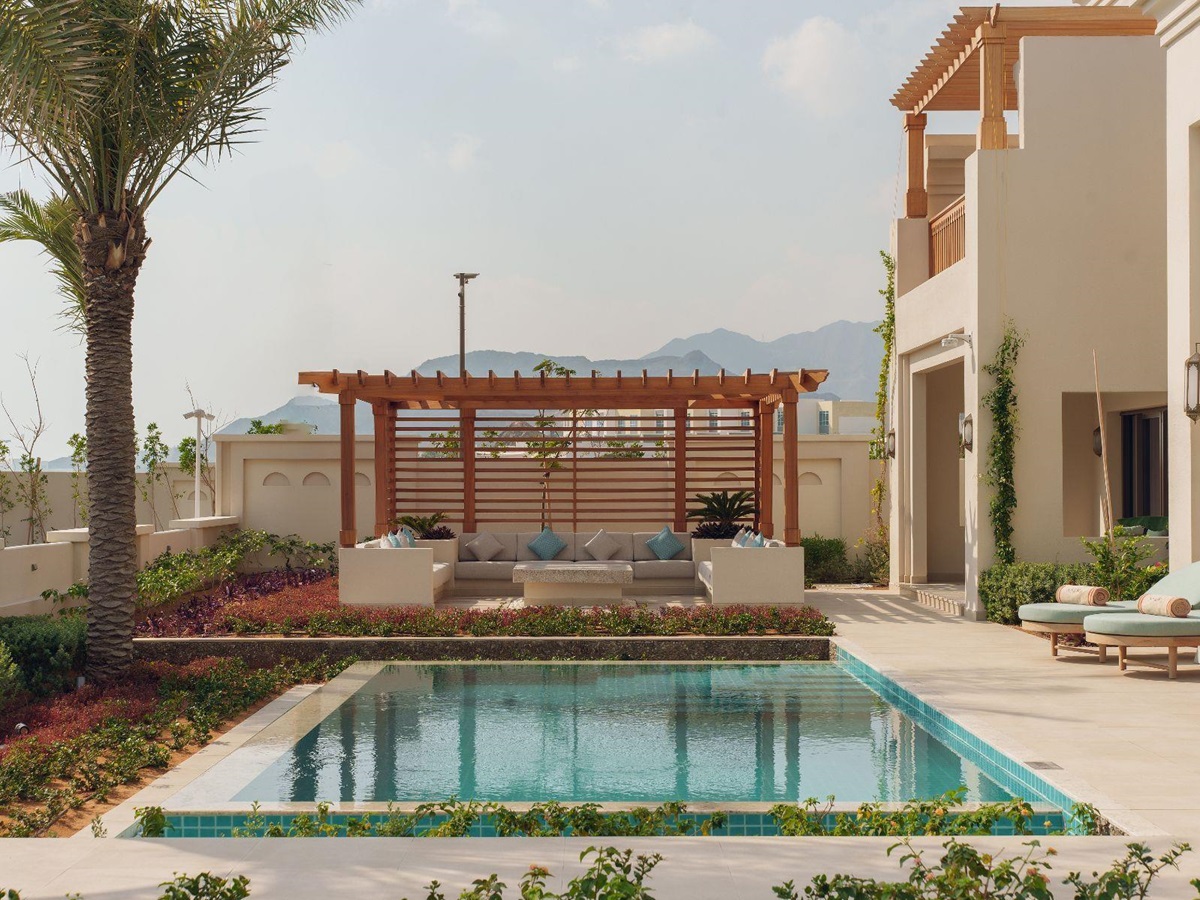 Exterior view and swimming pool of the four bed residence at Naama Beach Villas & Spa in Al Aqah, Fujairah