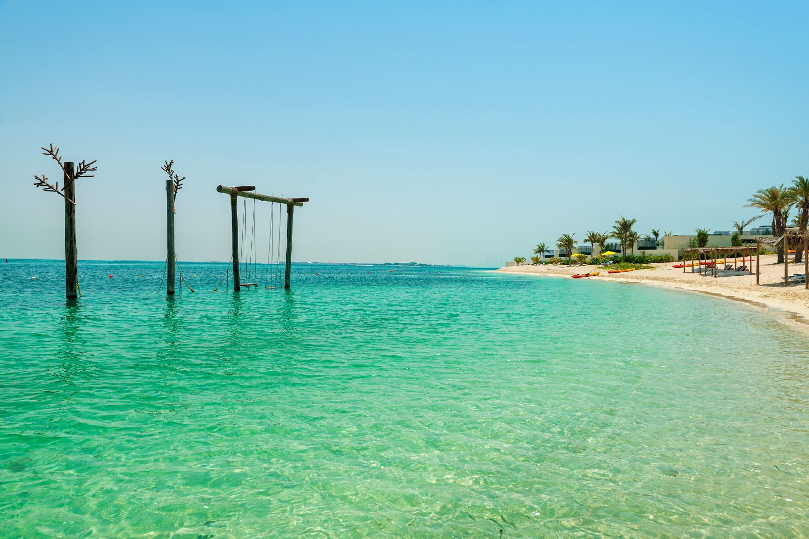 Swings on the beachfront at Nurai Island near Abu Dhabi in the United Arab Emirates