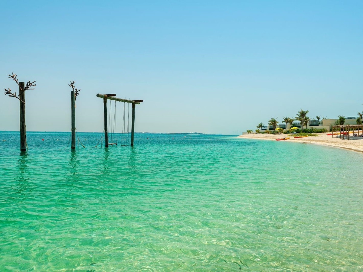 Swings on the beachfront at Nurai Island near Abu Dhabi in the United Arab Emirates