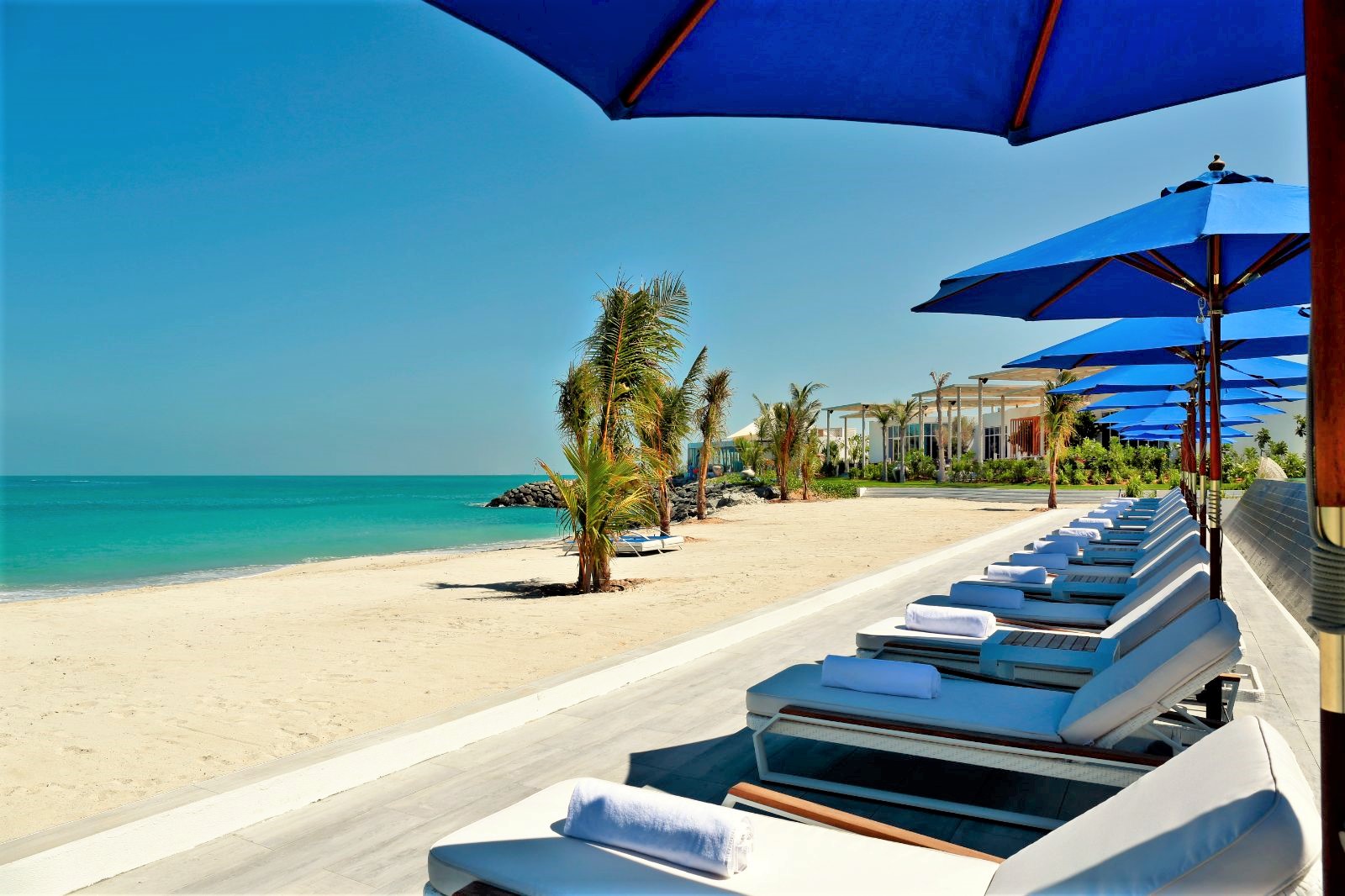 Beachfront sun loungers at Nurai Island resort  in Abu Dhabi in the United Arab Emirates