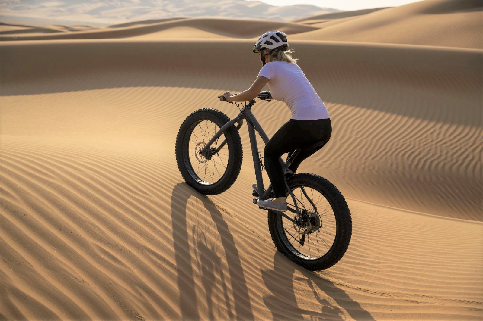 Fat biking in the Liwa Desert near Qasr Al Sarab Desert Resort in the United Arab Emirates