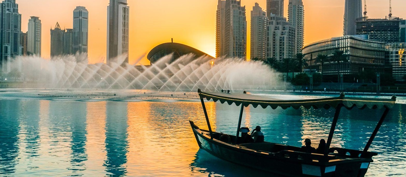 Boat on Dubai creek approaching the fountains
