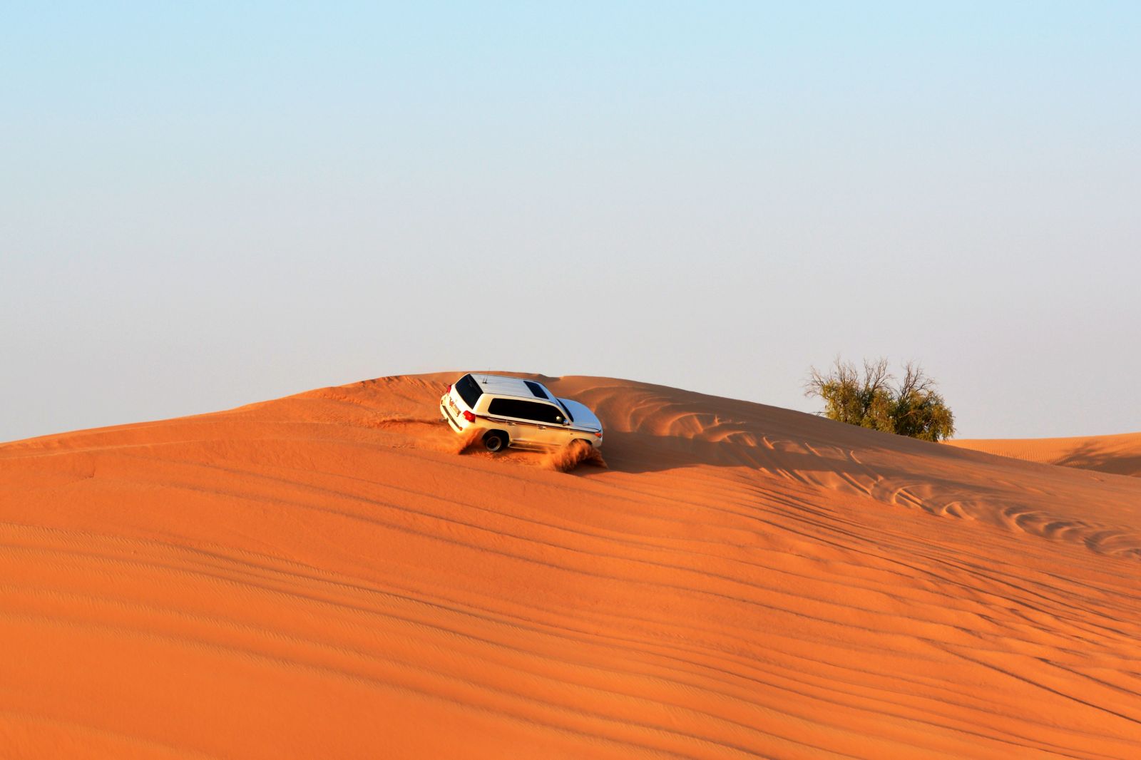 Aerial view of a 4x4 dune bashing in the Abu Dhabi desert