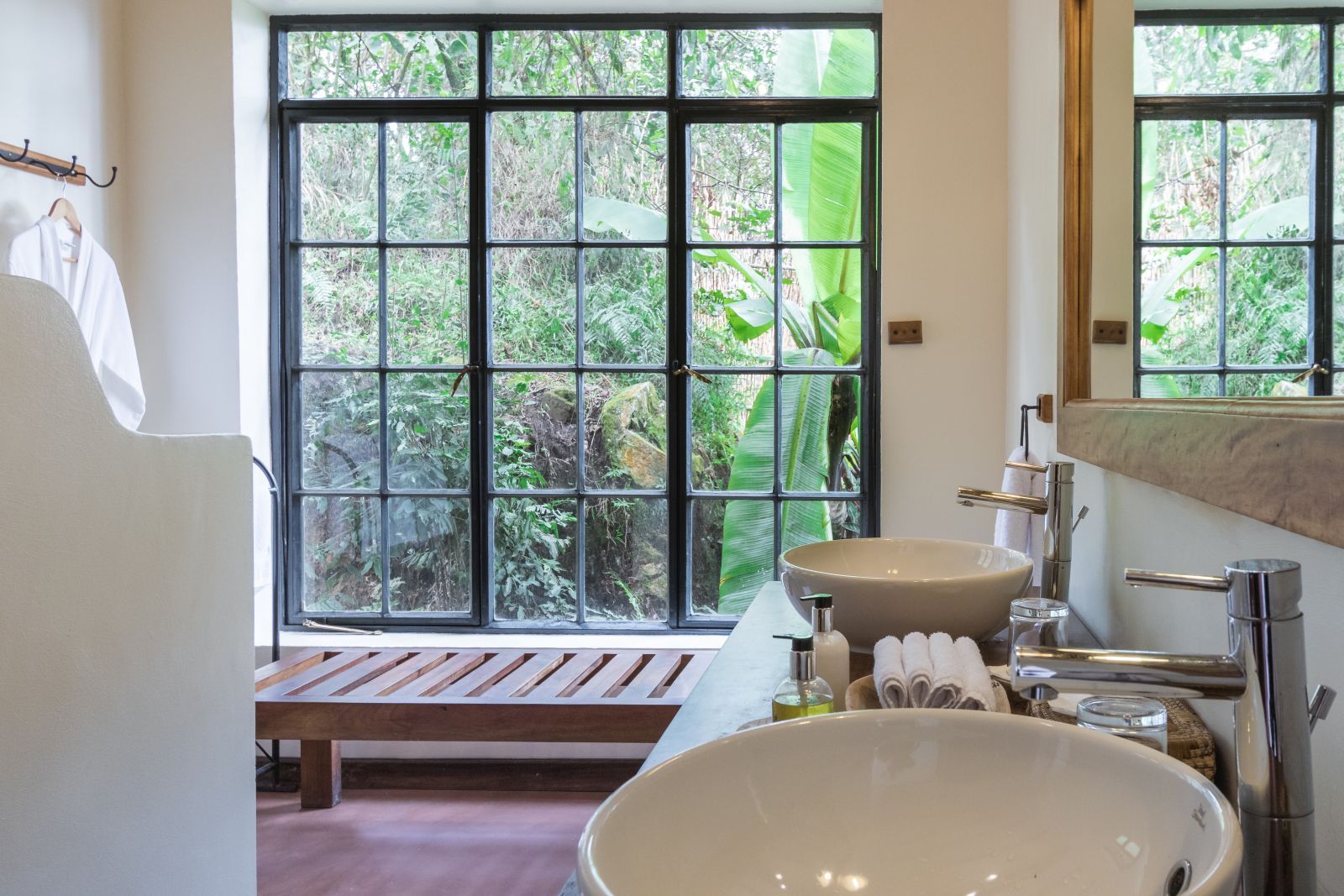 A bathroom with double sinks at Clouds Mountain Gorilla Lodge in Uganda