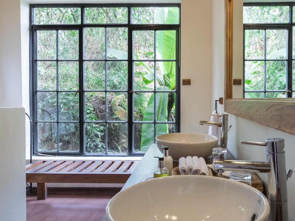 A bathroom with double sinks at Clouds Mountain Gorilla Lodge in Uganda