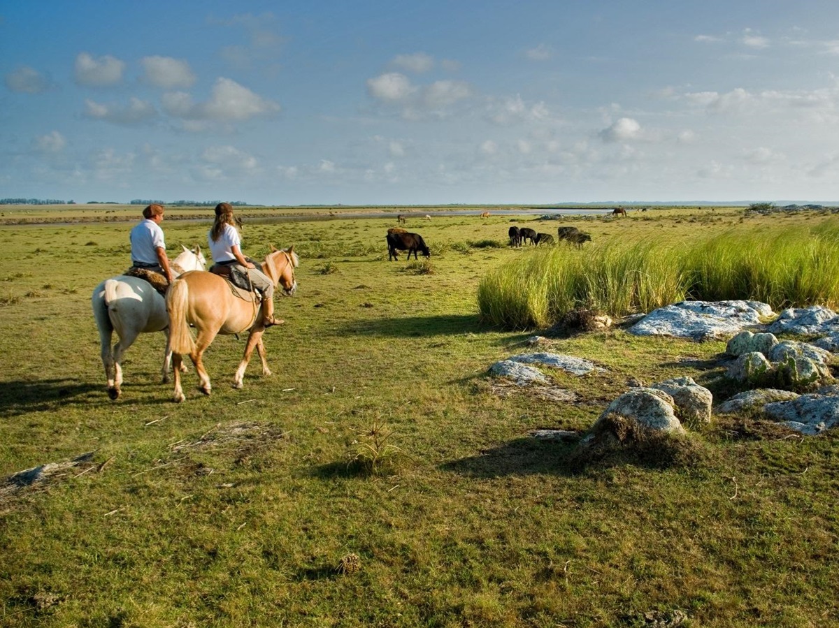 Two horse riders near Estancia, Uruguay