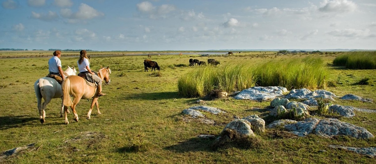Two horse riders near Estancia, Uruguay