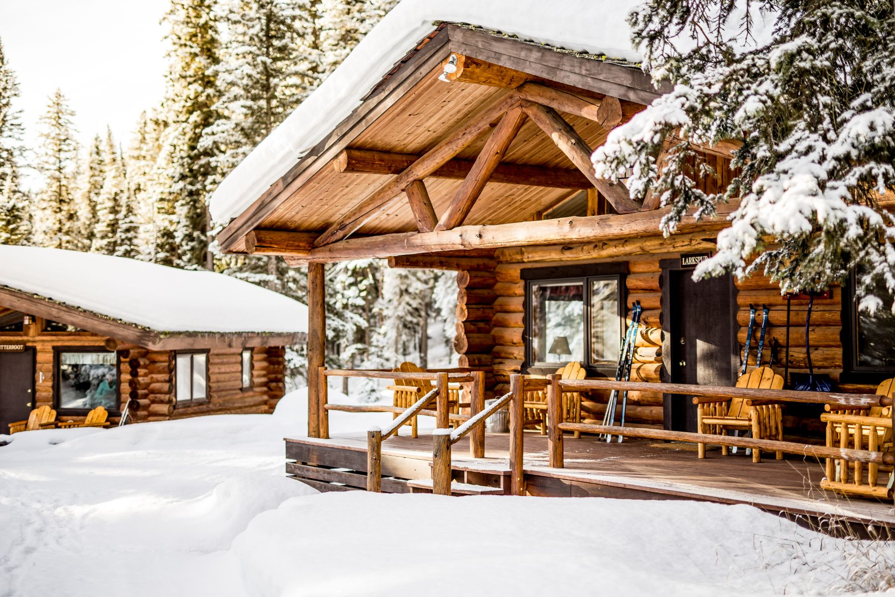 Exterior view of a cabin covered in snow at Lone Mountain Ranch in Montana