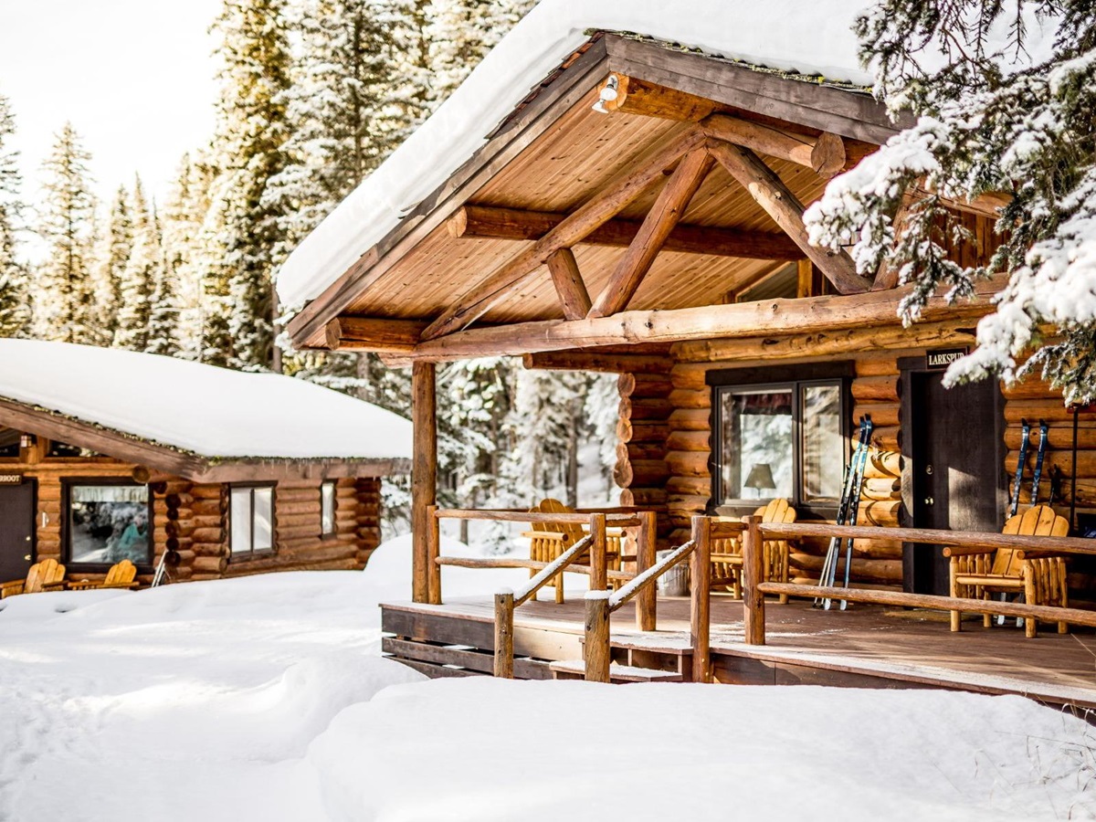 Exterior view of a cabin covered in snow at Lone Mountain Ranch in Montana