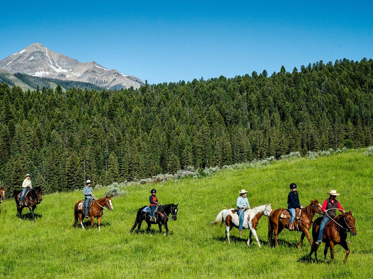 Guests riding through the wilderness at Lone Mountain Ranch in Montana