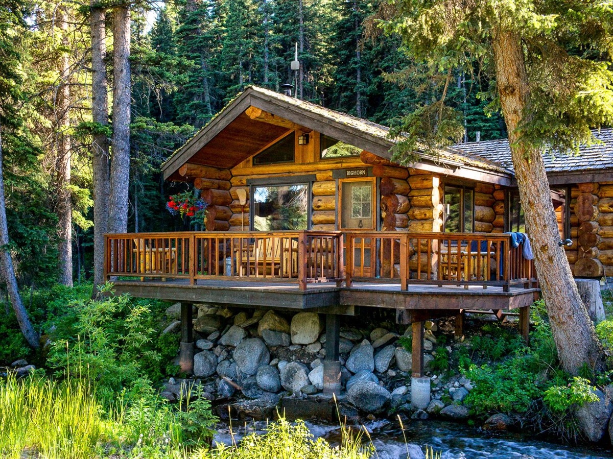 Exterior view of a guest cabin over water at Lone Mountain Ranch in Montana