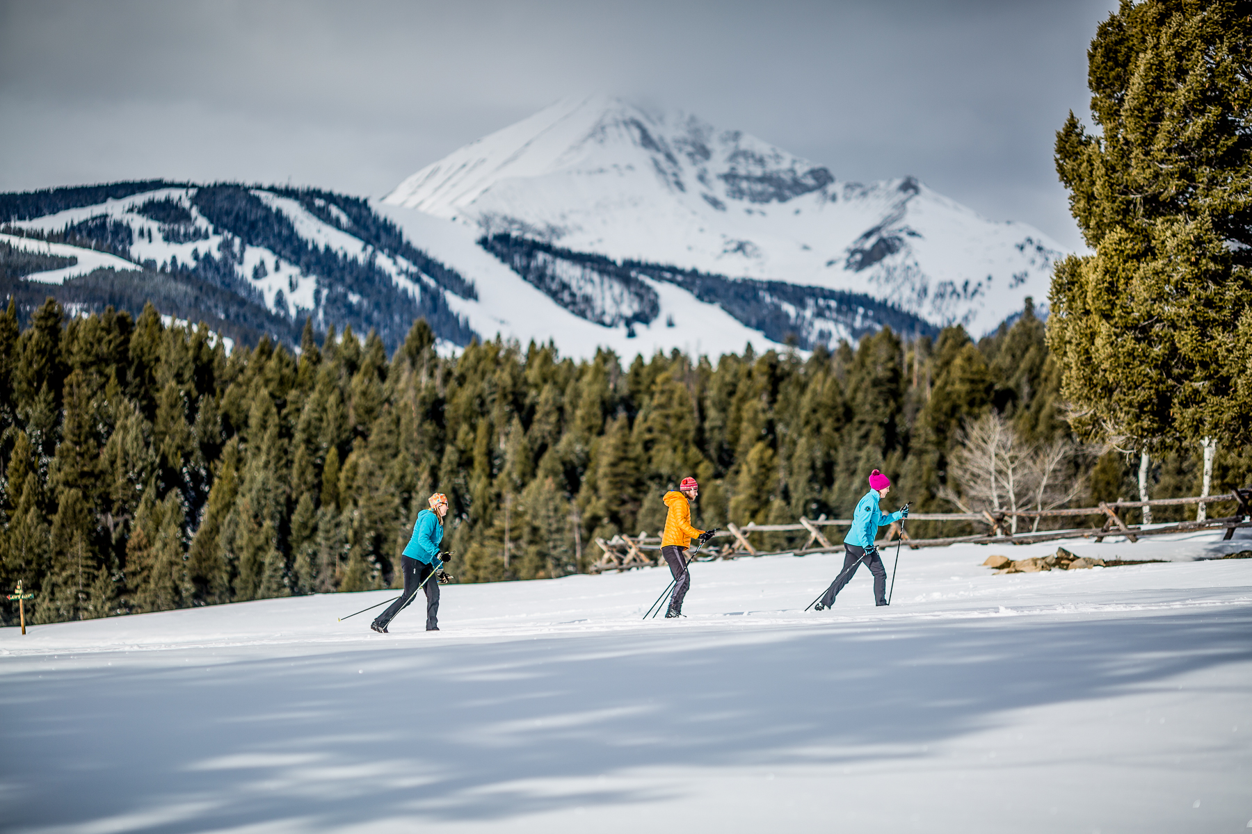 Guests of Lone Mountain Ranch in Montana skiing a cross country trail