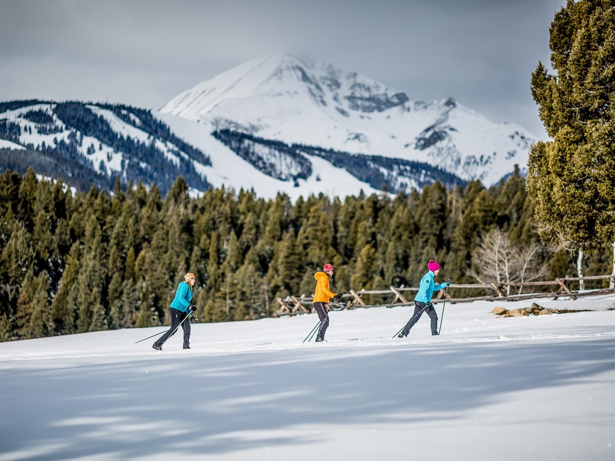Guests of Lone Mountain Ranch in Montana skiing a cross country trail
