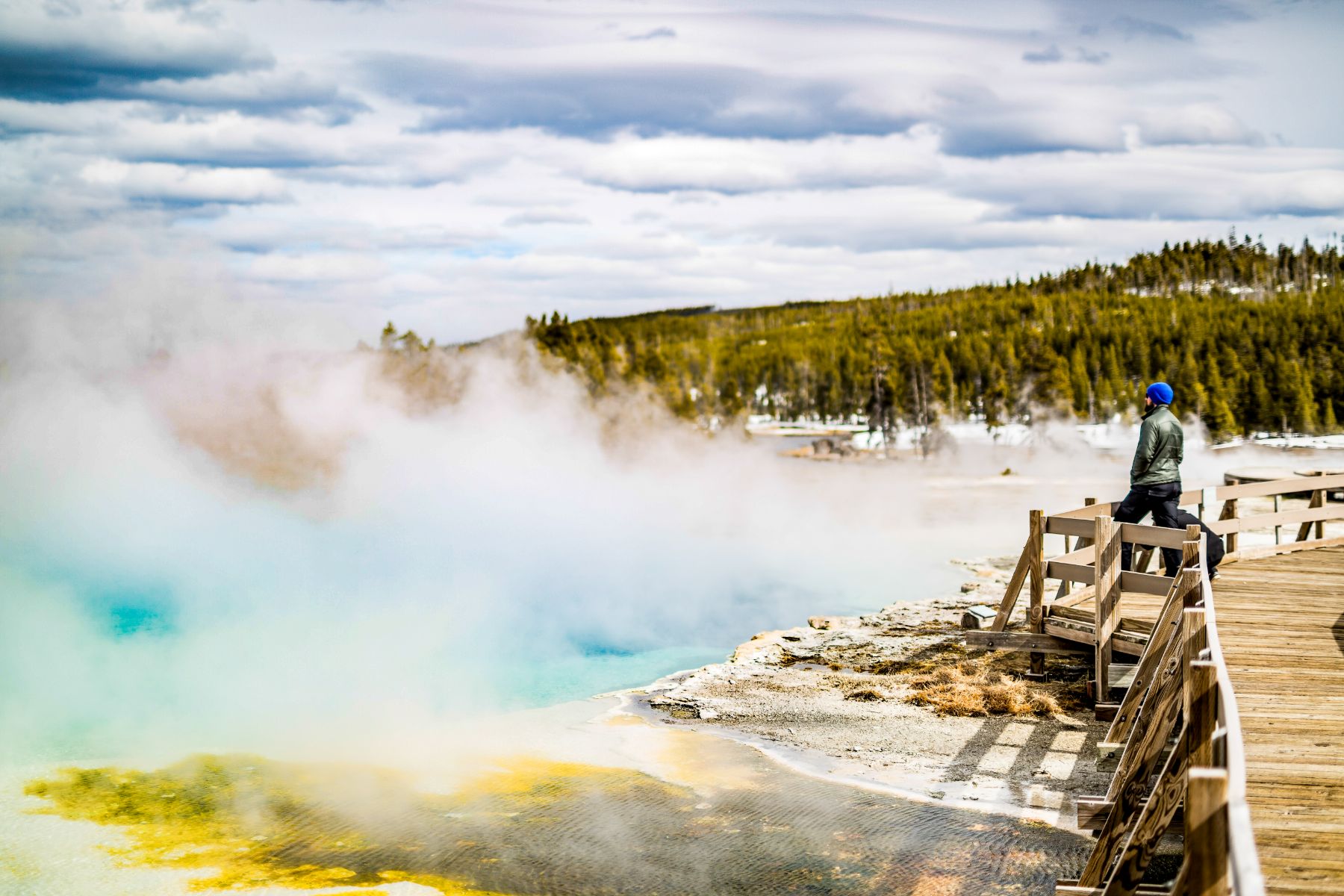 A guest of Lone Mountain Ranch admiring the hot springs