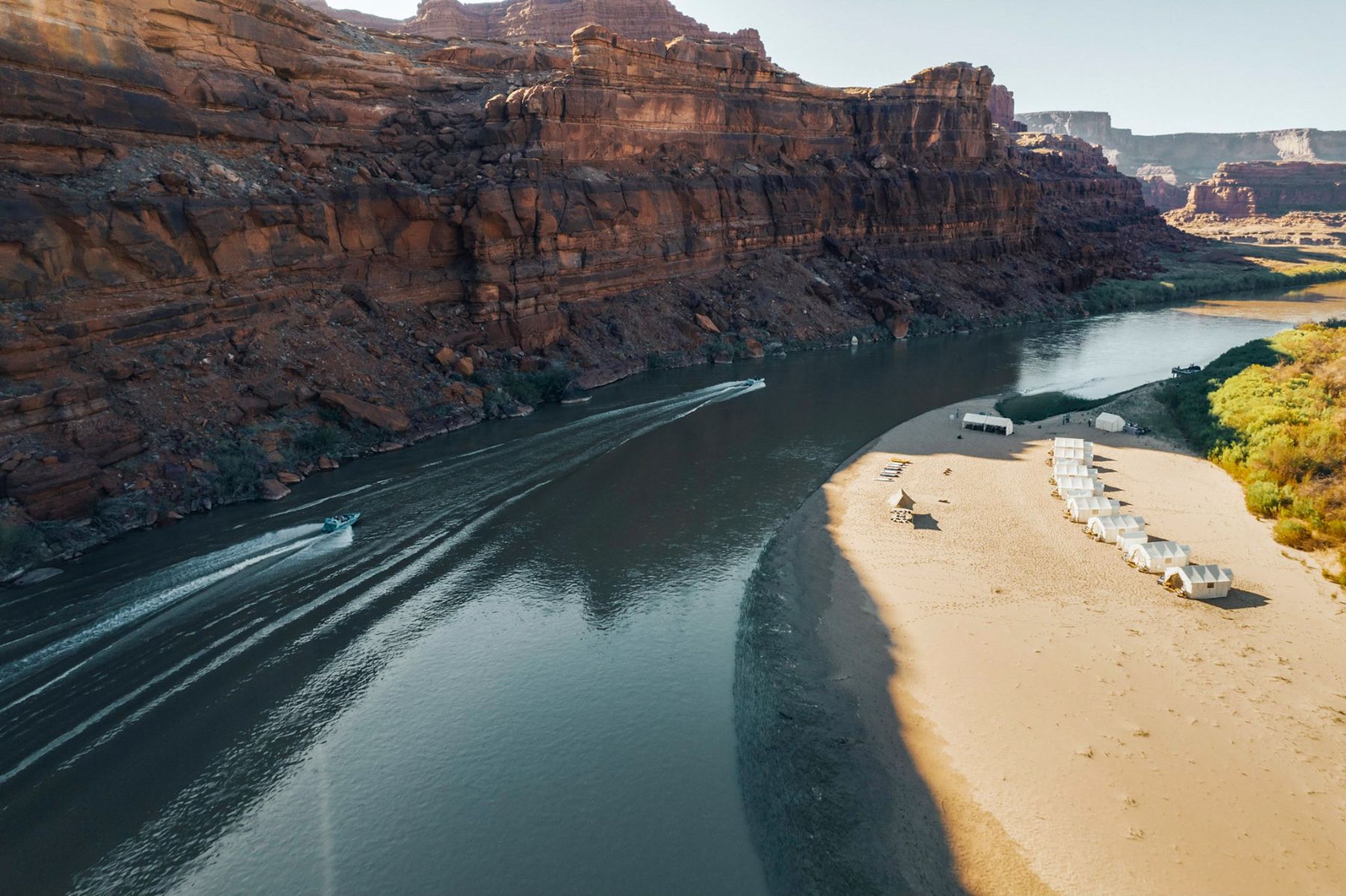 Aerial view of an EXP Journeys mobile camp set up on the banks of the Colorado River