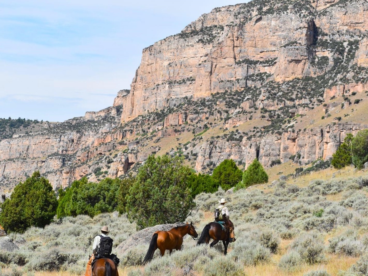 Riding through the canyon at Paintrock Canyon Ranch in Wyoming, photo: Shiner Webb