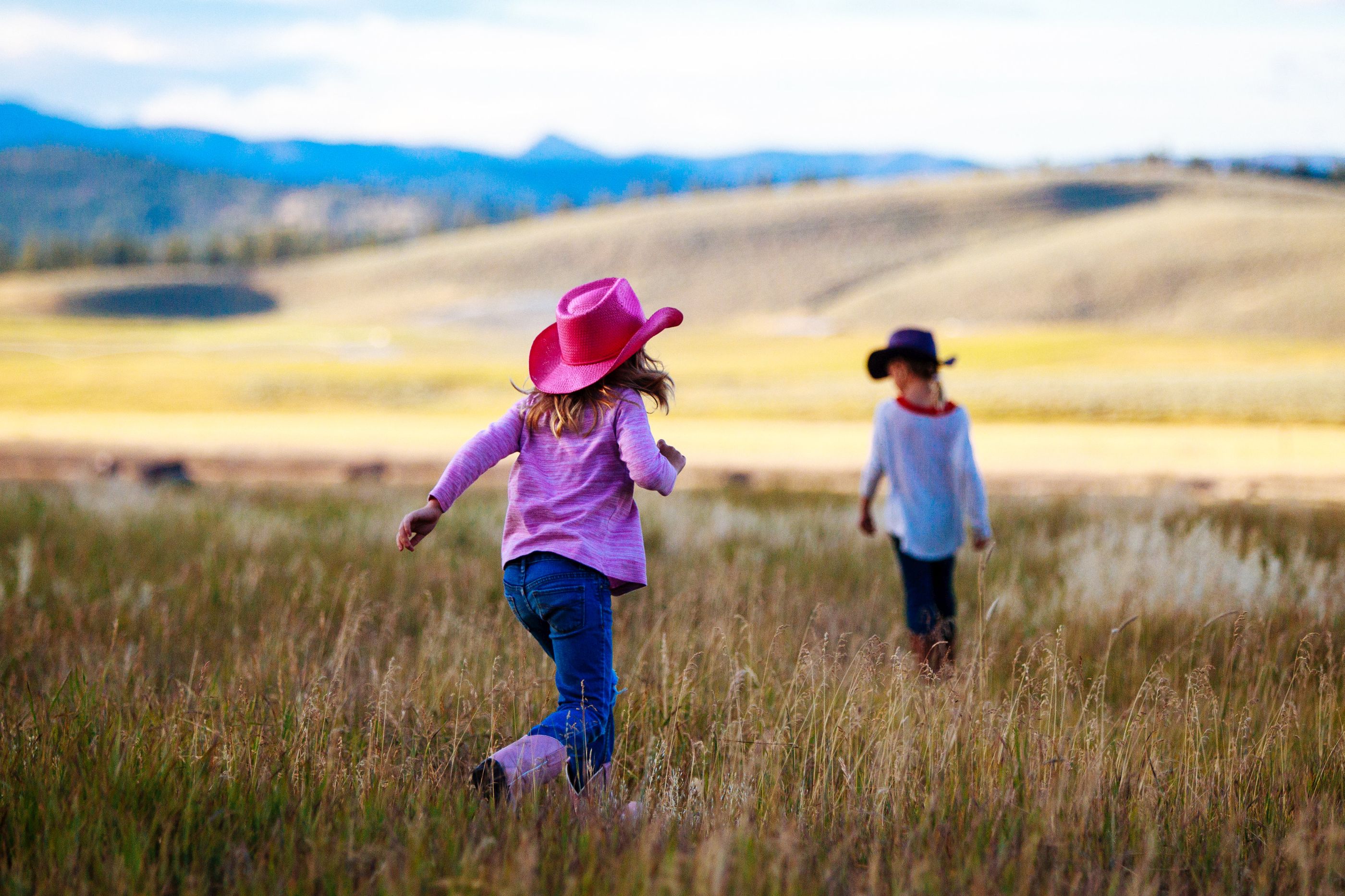 Children playing in the field of Paws Up Ranch, USA