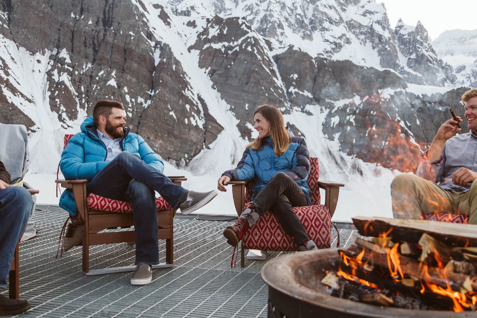 Warming drinks around the fire pit at Sheldon Chalet Alaska
