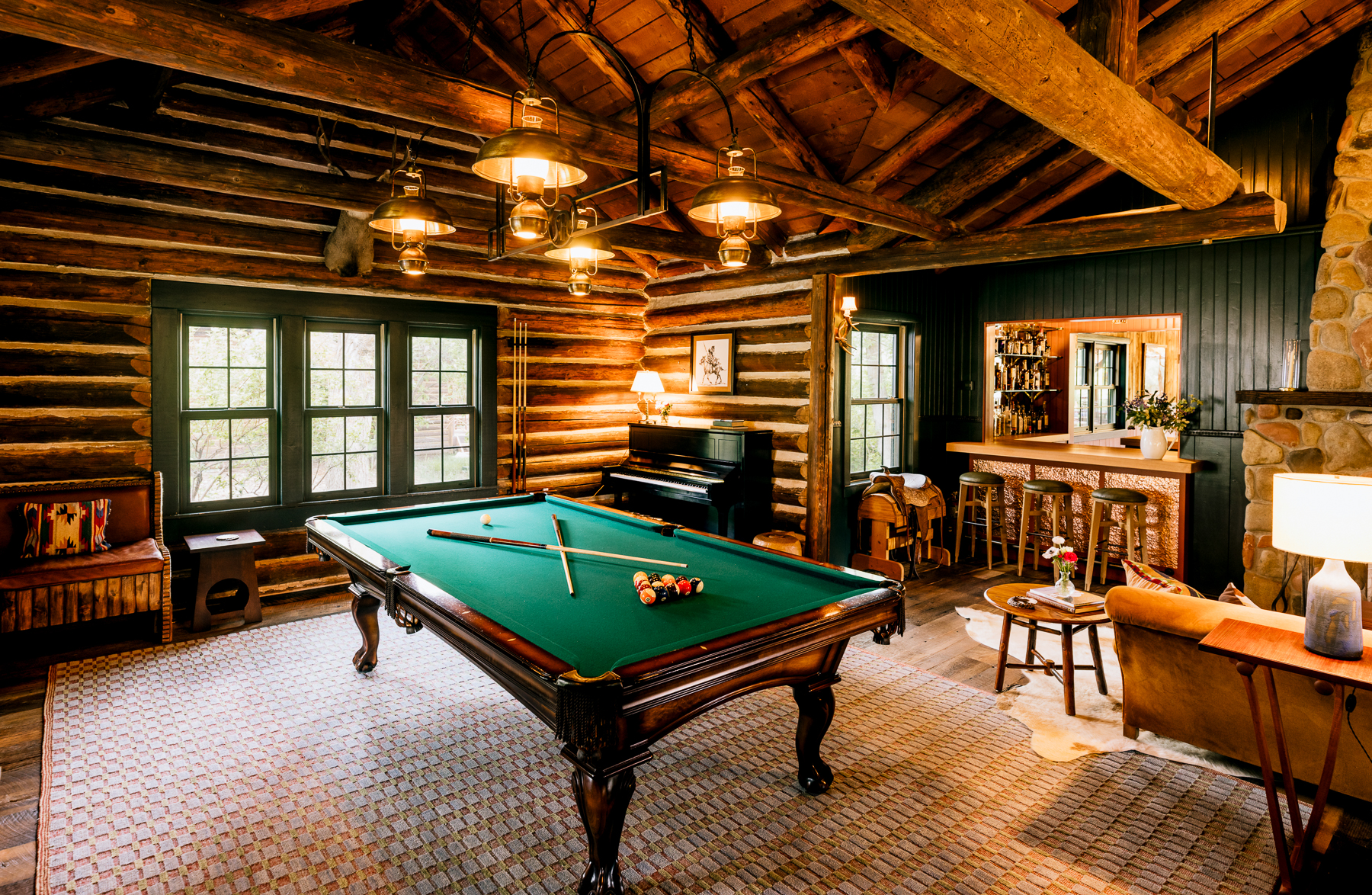 Pool table and living area at Smith Fork Ranch in Colorado