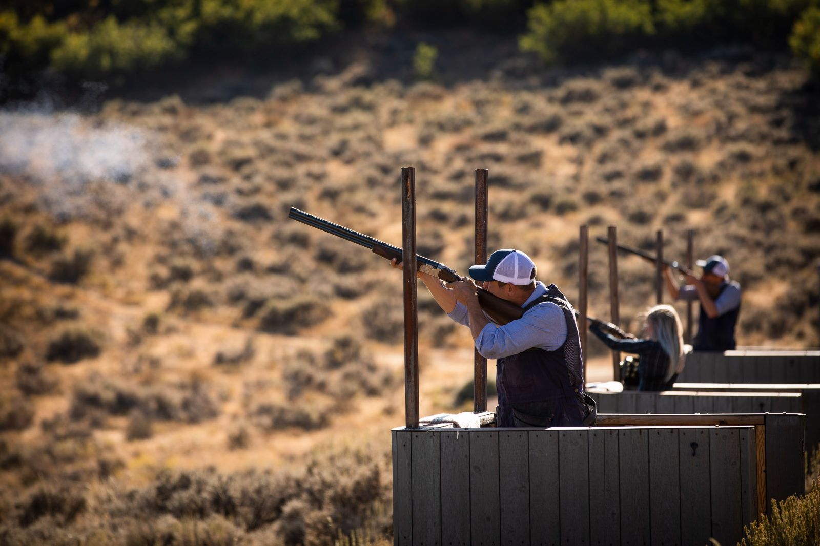 People clay pigeon shooting at luxury lodge The Lodge at Blue Sky 