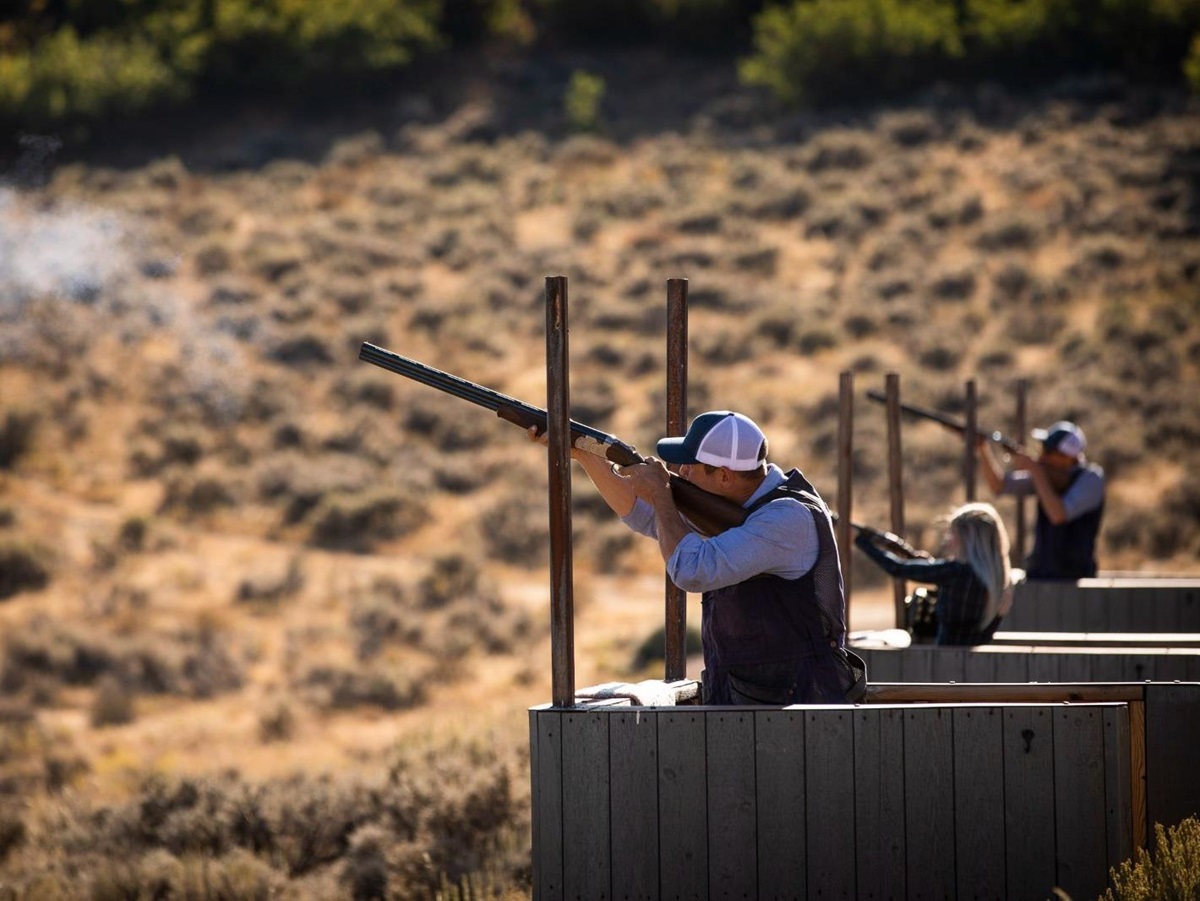 People clay pigeon shooting at luxury lodge The Lodge at Blue Sky