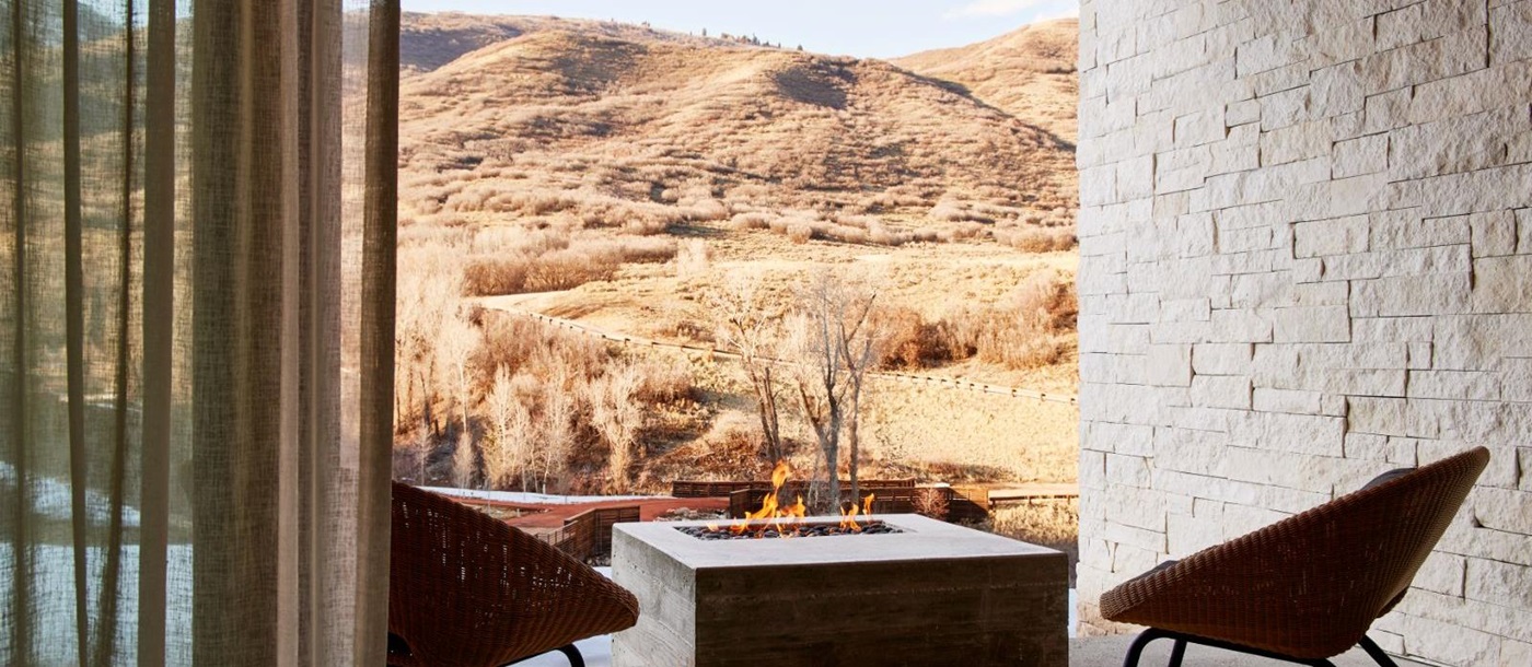 Outdoor terrace with a firepit in the Earth Suite at luxury lodge The Lodge at Blue Sky