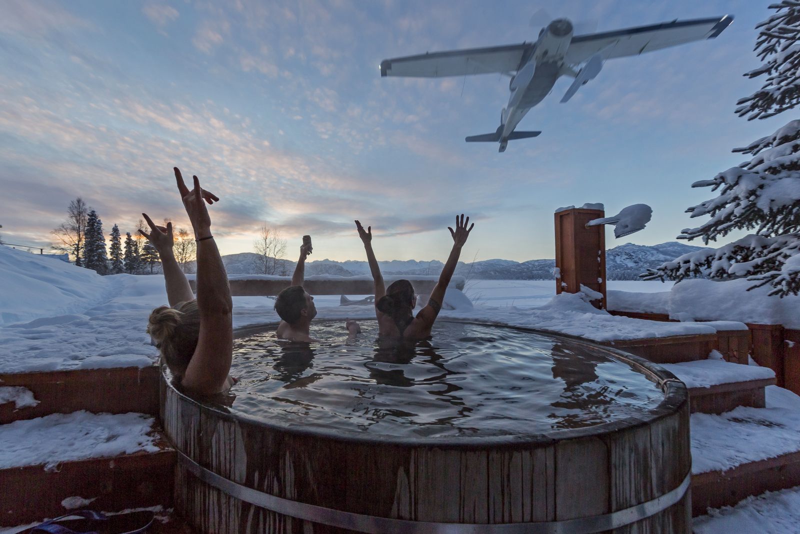 Guests in hot tub at Tordrillo Mountain Lodge Alaska