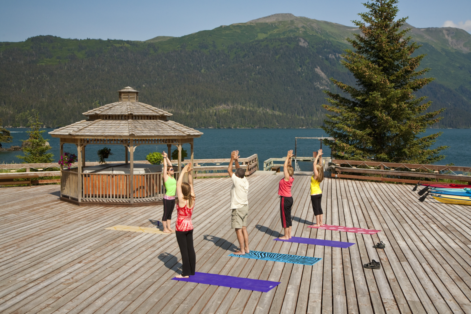 Yoga session on the pavilion at Tutka Bay Lodge in Alaska, USA