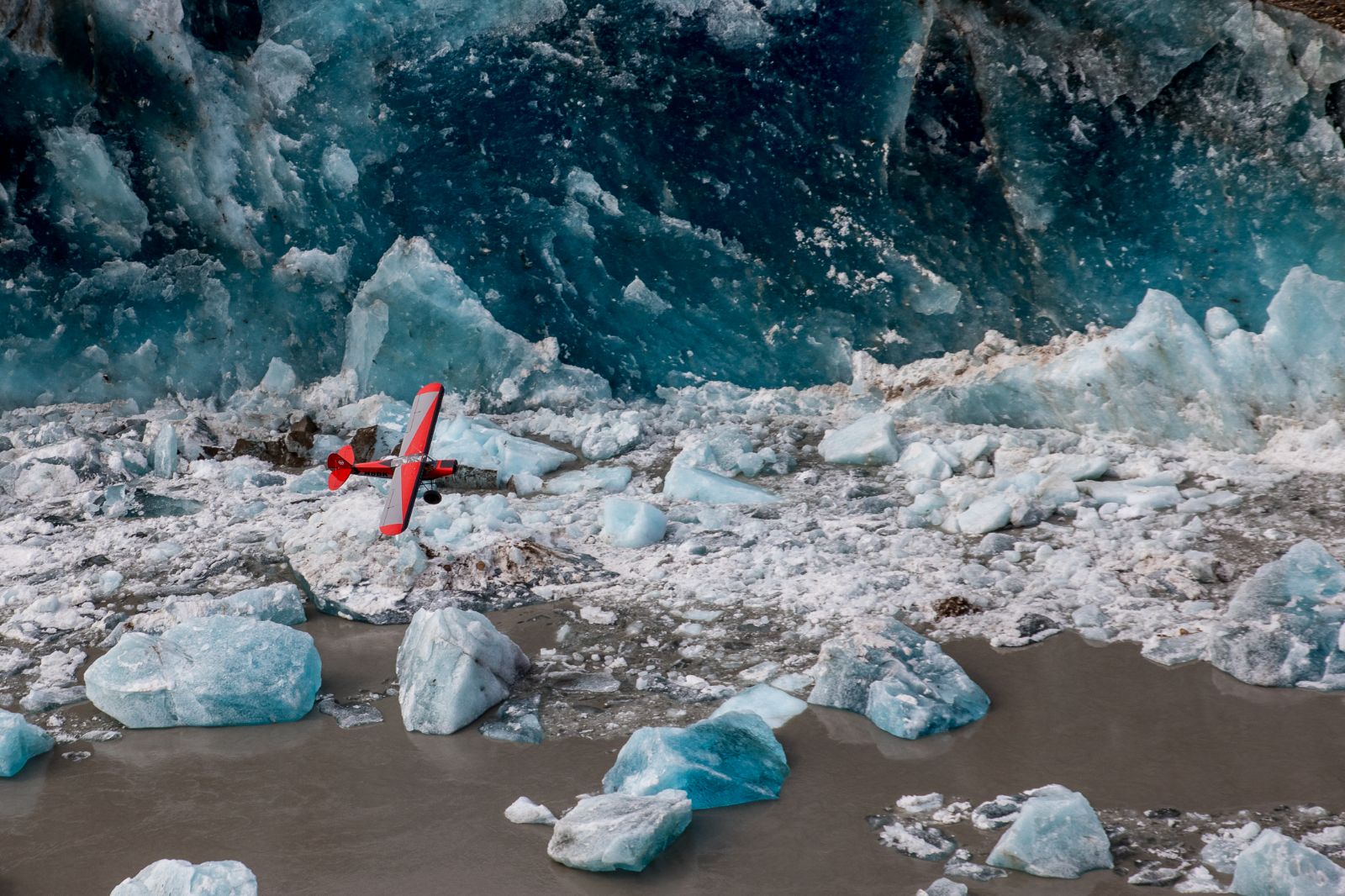 Plane flying over a glacier near Ulitma Thule Lodge in Alaska's Wrangell-St Elias. National Park