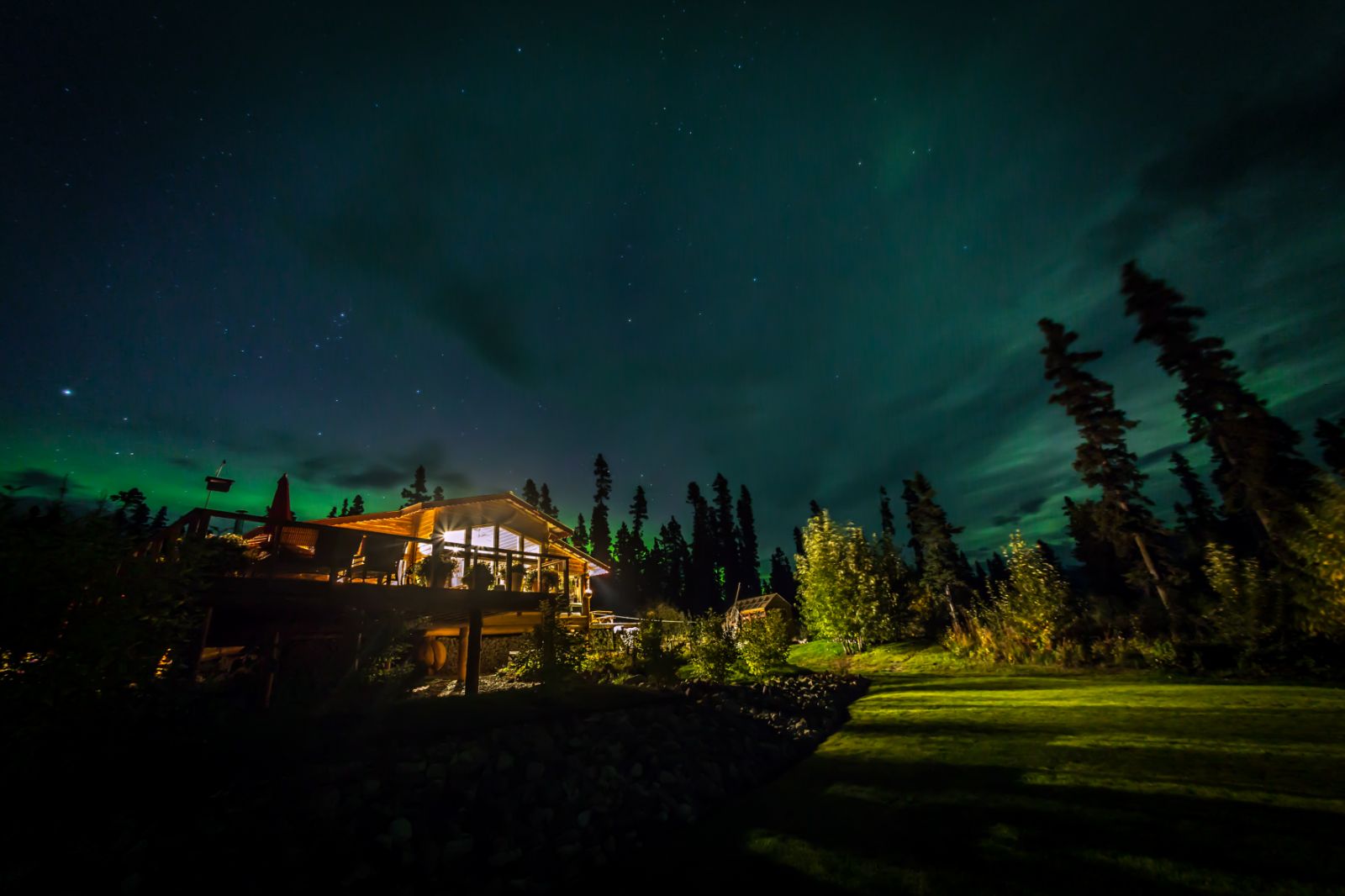 Northern lights on the grounds of Ulitma Thule Lodge in Alaska's Wrangell-St Elias. National Park
