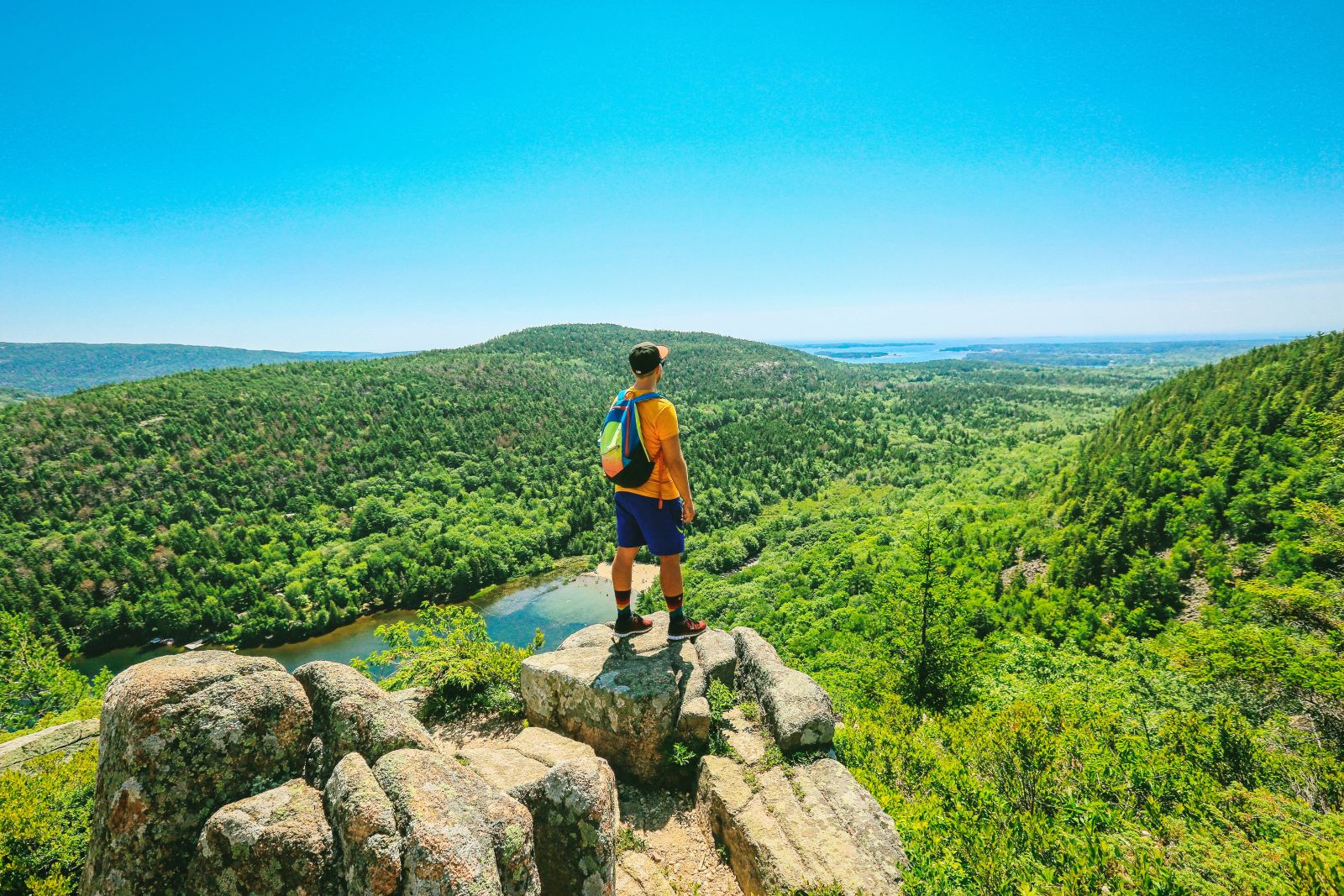 Hiker admiring views in Acadia National Park, Maine, USA