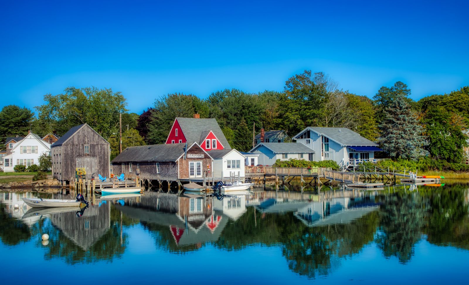 Reflections of houses in Kennenbunk Port in Maine USA