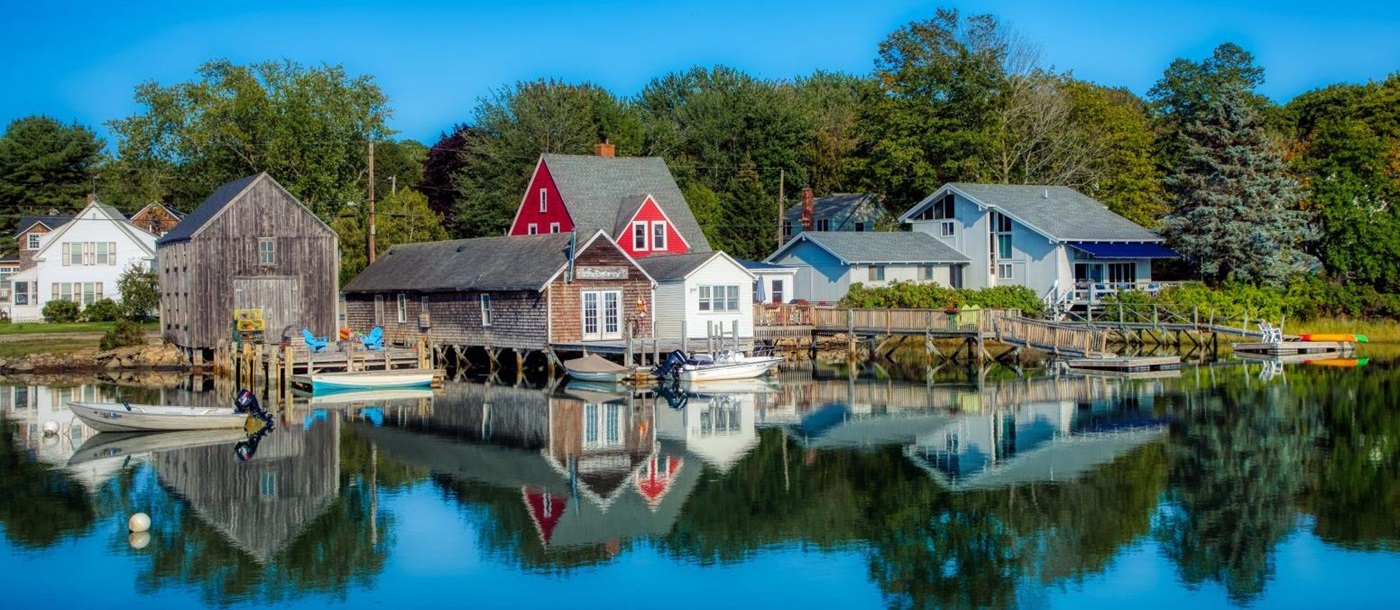 Reflections of houses in Kennenbunk Port in Maine USA
