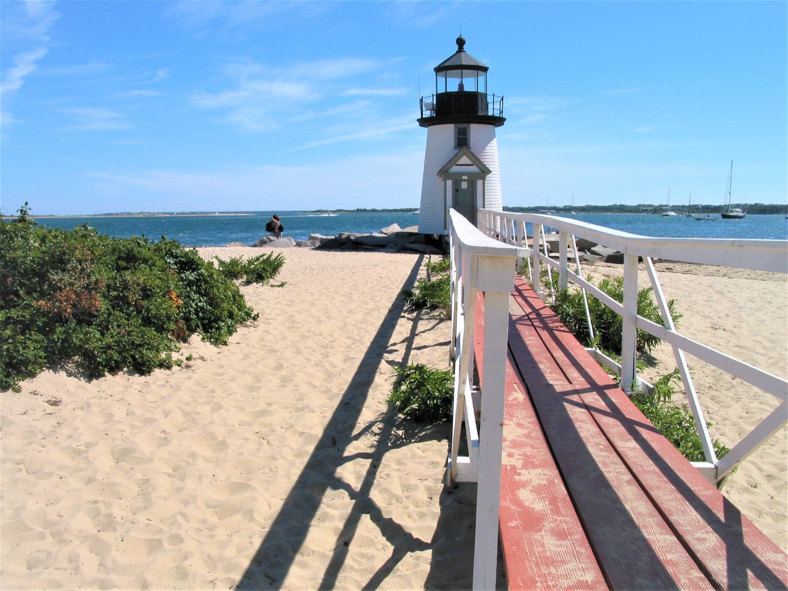 Blue and white lighthouse on the beach