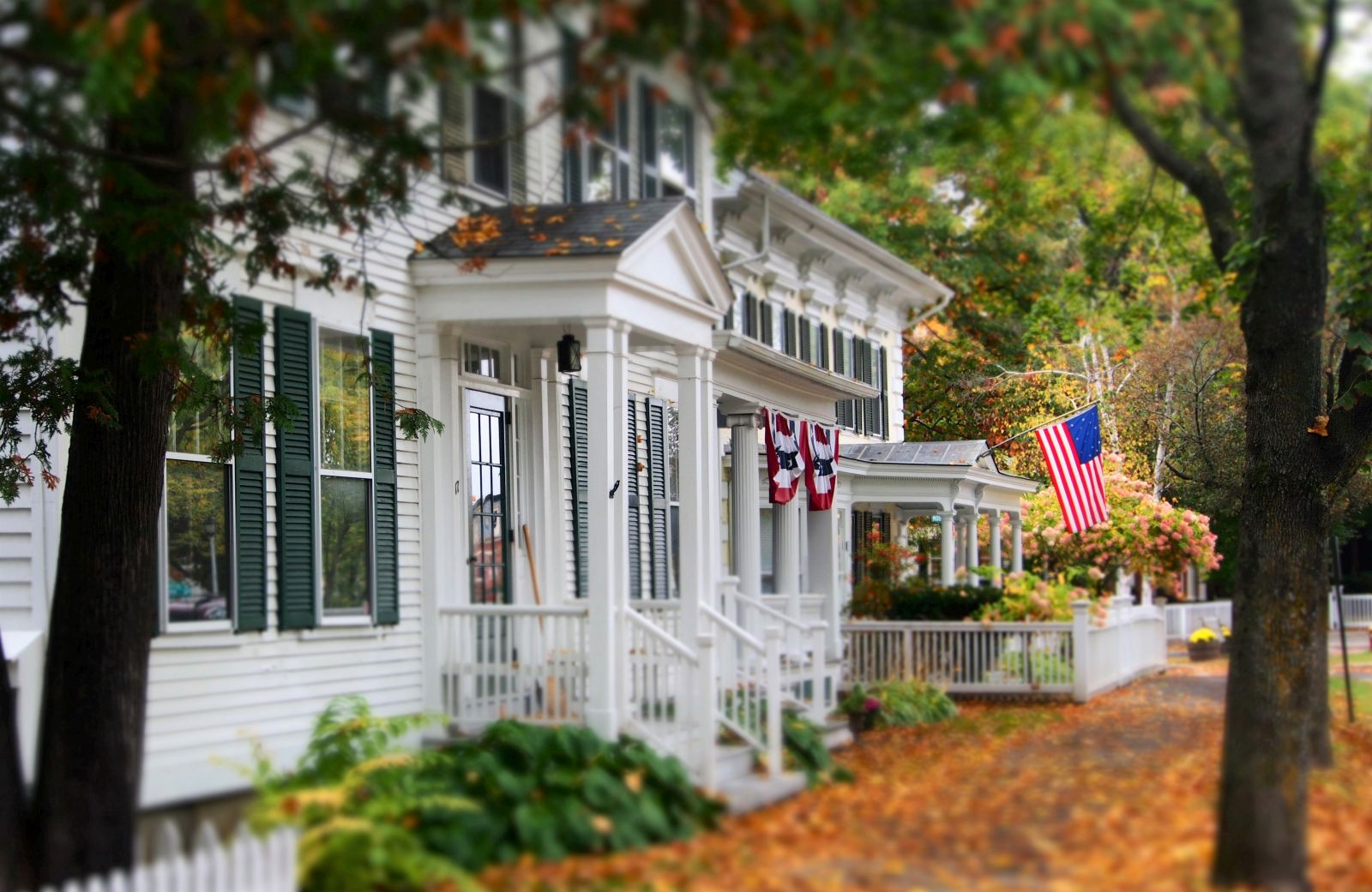 A street in Woodstock Vermont USA with house and fall leaves