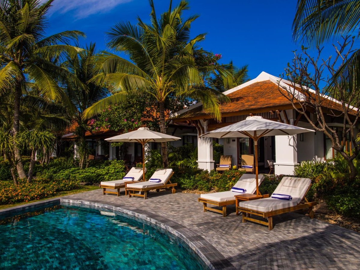 Sunbeds by a private villa pool at The Anam resort in Cam Ranh, Vietnam