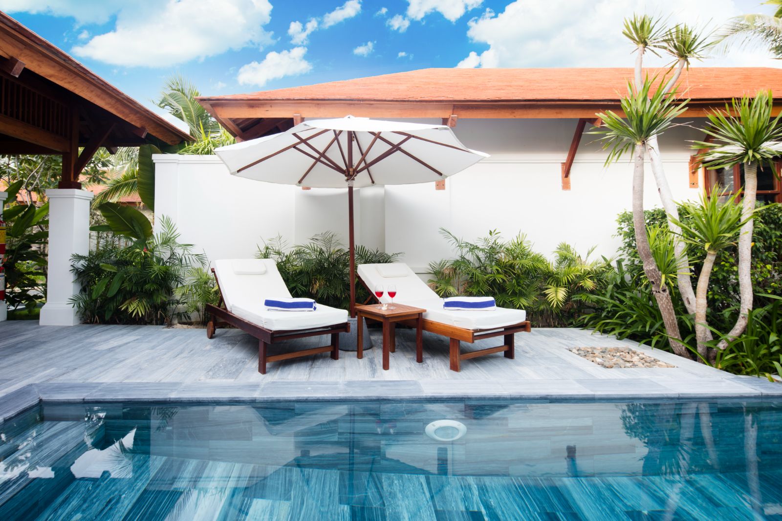 Private villa pool sunbeds at The Anam resort in Cam Ranh, Vietnam