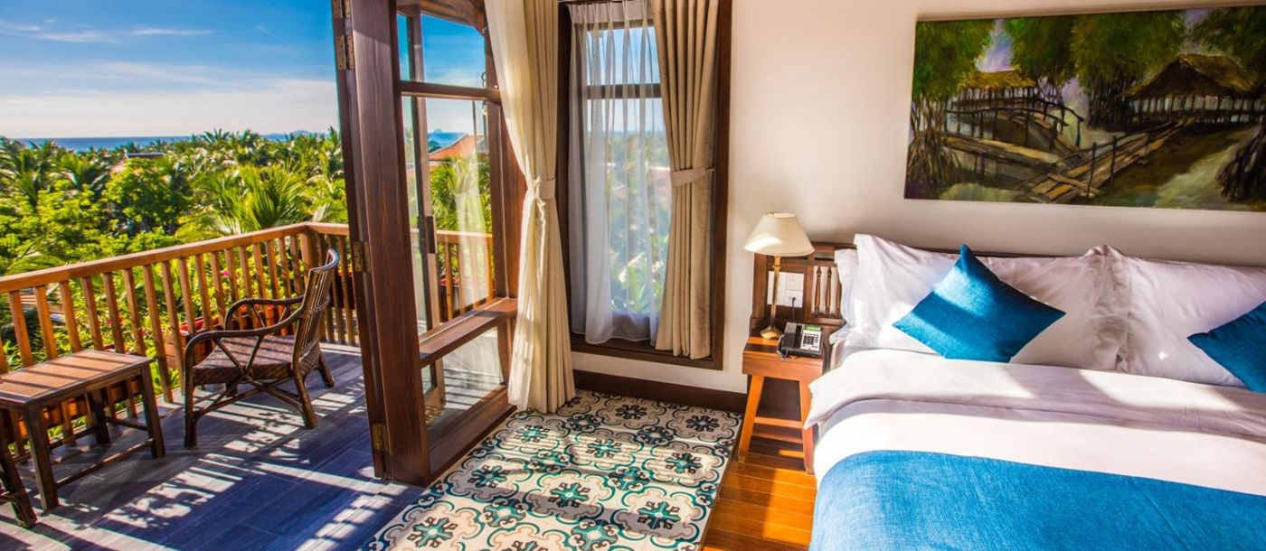 Private villa bedroom and balcony at The Anam resort in Cam Ranh, Vietnam