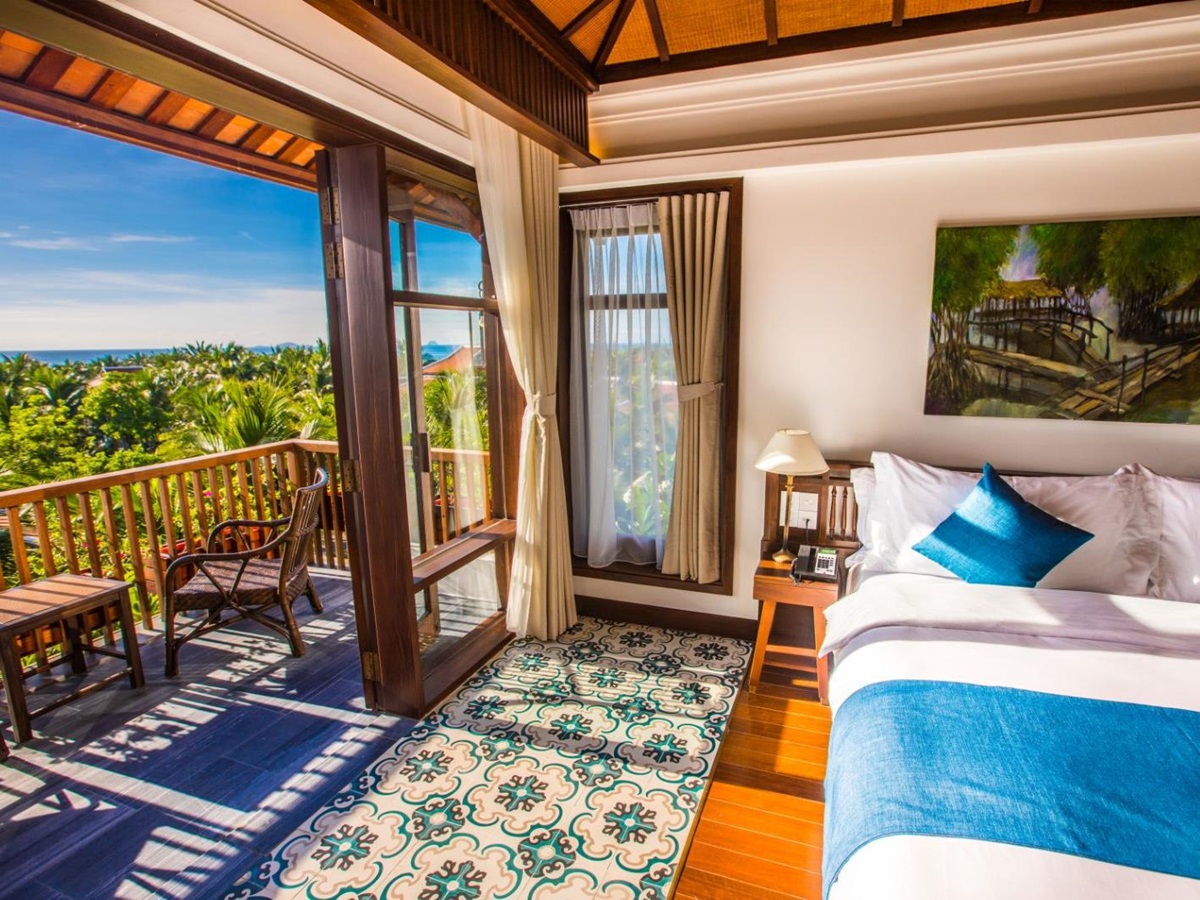 Private villa bedroom and balcony at The Anam resort in Cam Ranh, Vietnam