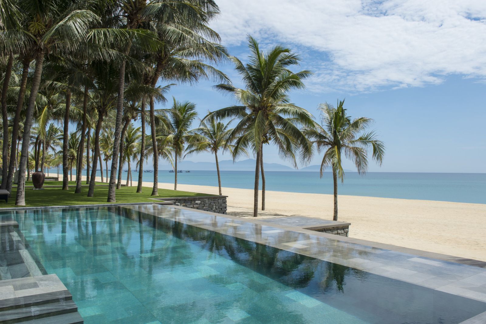 Swimming pool and beach at the Four Seasons Hoi An Nam Hai Vietnam
